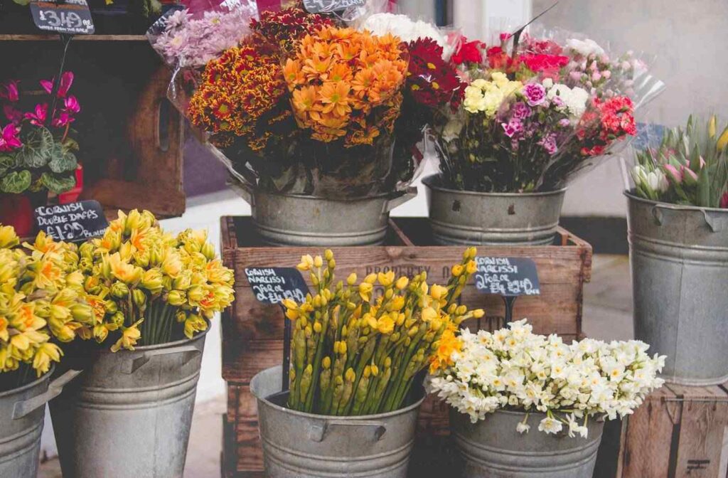 Flowers in buckets for sale
